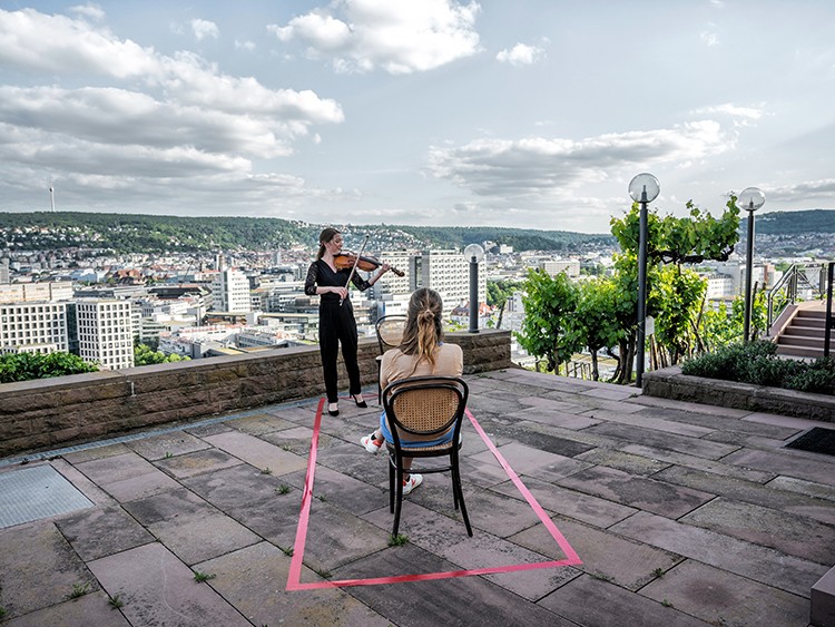 An audience of one during a concert in Stuttgart, Germany, May 26, 2020. The coronavirus pandemic has forced the cancellation of most cultural events, including concerts, but two German orchestras found an intensely personal way to play on. (Laetitia Vancon/The New York Times)