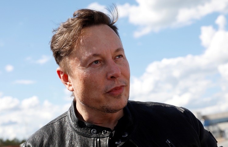 FILE PHOTO: SpaceX founder and Tesla CEO Elon Musk looks on as he visits the construction site of Tesla's gigafactory in Gruenheide, near Berlin, Germany, May 17, 2021. REUTERS/Michele Tantussi/File Photo