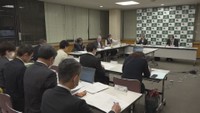 再検討会議　23日