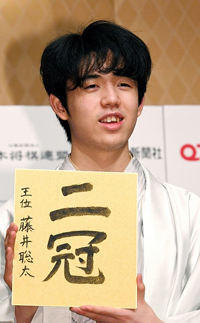 Local high school students perform Ningen Shogi, human Japanese chess on  top of Mt. Maizuru, in Tendo, Yamagata Prefecture on April 22, 2017. Tendo  is known for production of shogi koma,'' pieces