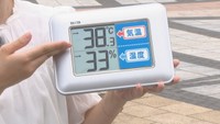 JR高松駅前で手元の温度計が38.3℃に