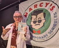 ８月発売の新刊を手にトークイベントに臨んだ田代まさし氏＝東京・渋谷