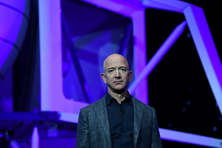 Amazon founder and Blue Origin founder Jeff Bezos answers media questions after unveiling plans to build a rocket manufacturing plant and launch site at Cape Canaveral Air Force Station, Florida September 15, 2015. HO/Mike Brown/Space Florida  THIS IMAGE HAS BEEN SUPPLIED BY A THIRD PARTY. IT IS DISTRIBUTED, EXACTLY AS RECEIVED BY REUTERS, AS A SERVICE TO CLIENTS. FOR EDITORIAL USE ONLY. NOT FOR SALE FOR MARKETING OR ADVERTISING CAMPAIGNS