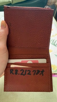 もらった日付と年齢が書かれたソメスサドルの財布／投稿主さん提供