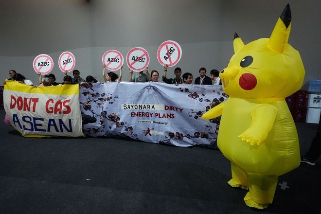 Protesters in Pikachu costumes demand Japan end fossil fuel financing at COP30