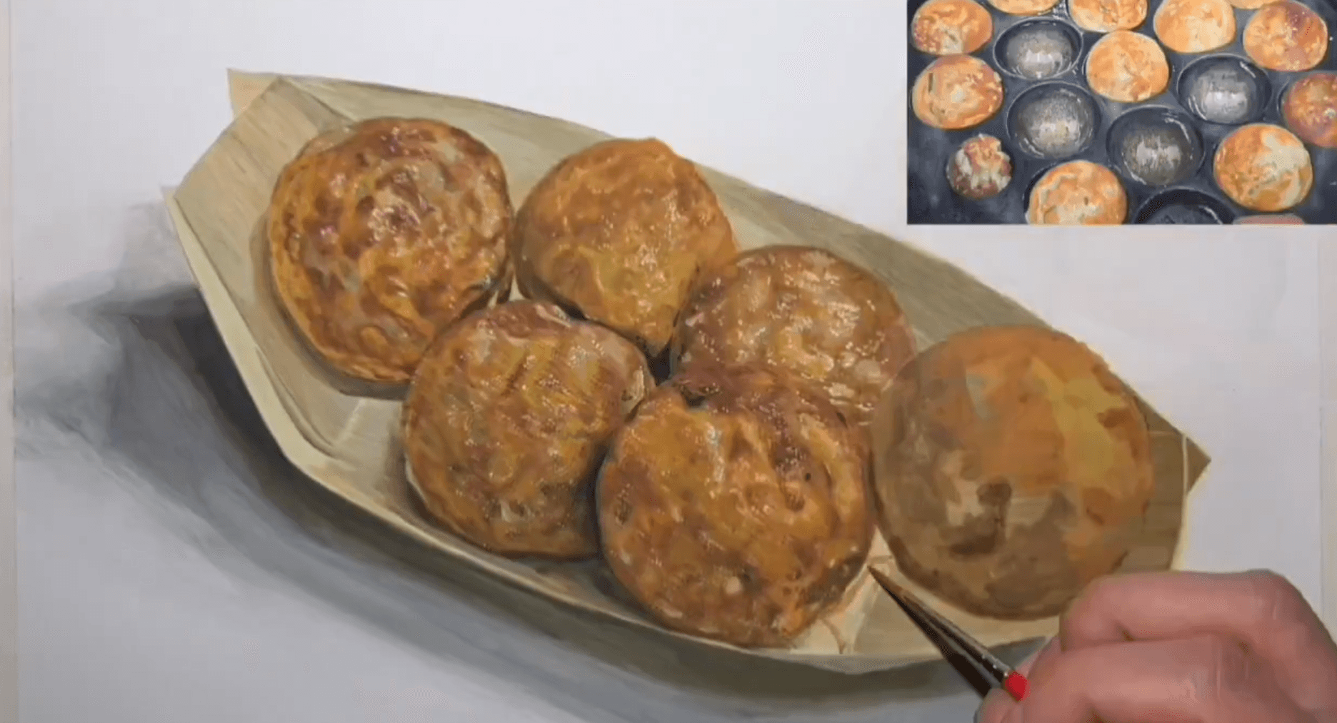 とうとう紙は2枚に。焼き上がった鉄板から箱舟に移動