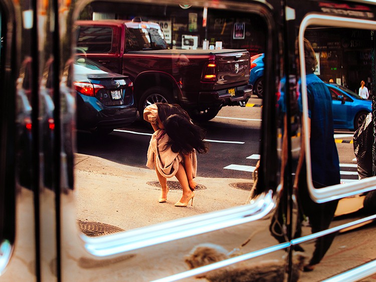 A pedestrian adjusts their high heels on the streets of New York on June 2, 2021. High-heeled shoes were at the point of flatlining, industry pundits fretted, teetering on the edge of extinction. Fast forward a few months to find those consumers trading comfort and function for the joy of dressing up. (Justin J Wee/The New York Times)