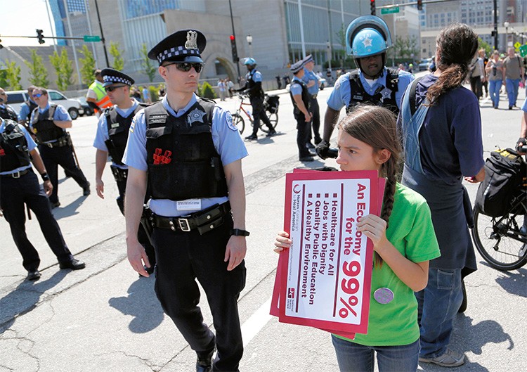 Protestors march in the streets as part of a demonstration ahead of the NATO Summit in Chicago, May 18, 2012. Leaders from members of the NATO alliance are expected to discuss the worsening situation in Afghanistan, and protest organizers said they hope thousands of people will turn out to demonstrate against the war and other issues such as income inequality.    REUTERS/Darren Hauck (UNITED STATES - Tags: POLITICS BUSINESS)