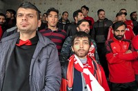 Zeinab, a 22-year-old girl. It seems strange to men that a girl has disguised herself as men to enter the stadium.As a female photographer, I'm not permitted to take my camera to the stadium. Therefore, I had to pass myself of as a boy and use my iPhone to take this shot.