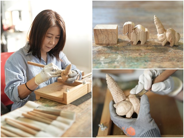 アトリエでの制作の様子。クスノキの木片から一木造りで猫を彫り出す