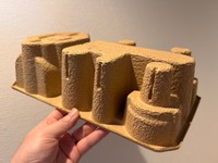 ドライヤーの梱包用の中枠を裏返したところ、砂漠の街並みのように見えたという一枚／バギさん（@BAGI8461）提供
