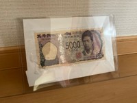 修復を終え、額に入れて保管されている五千円札／i1105さん（@asdfg32296822） 提供
